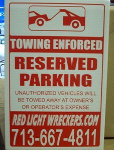 unauthorized vehicles will be towed sign