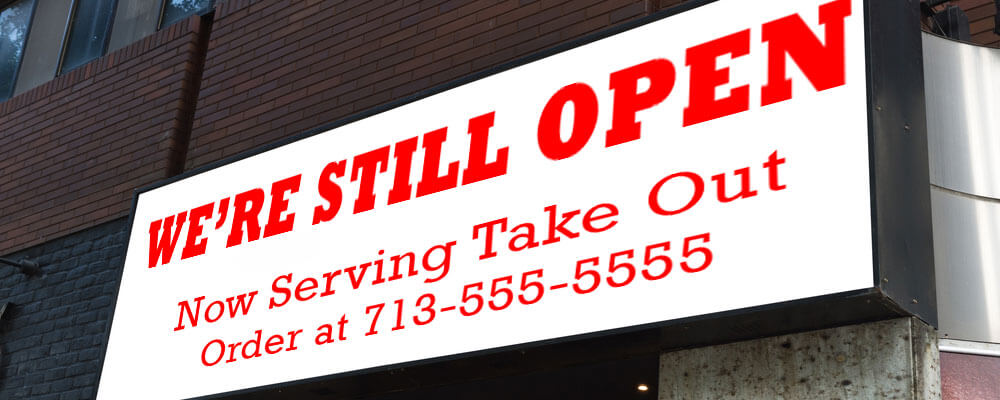 We're Still Open banner in Houston, TX